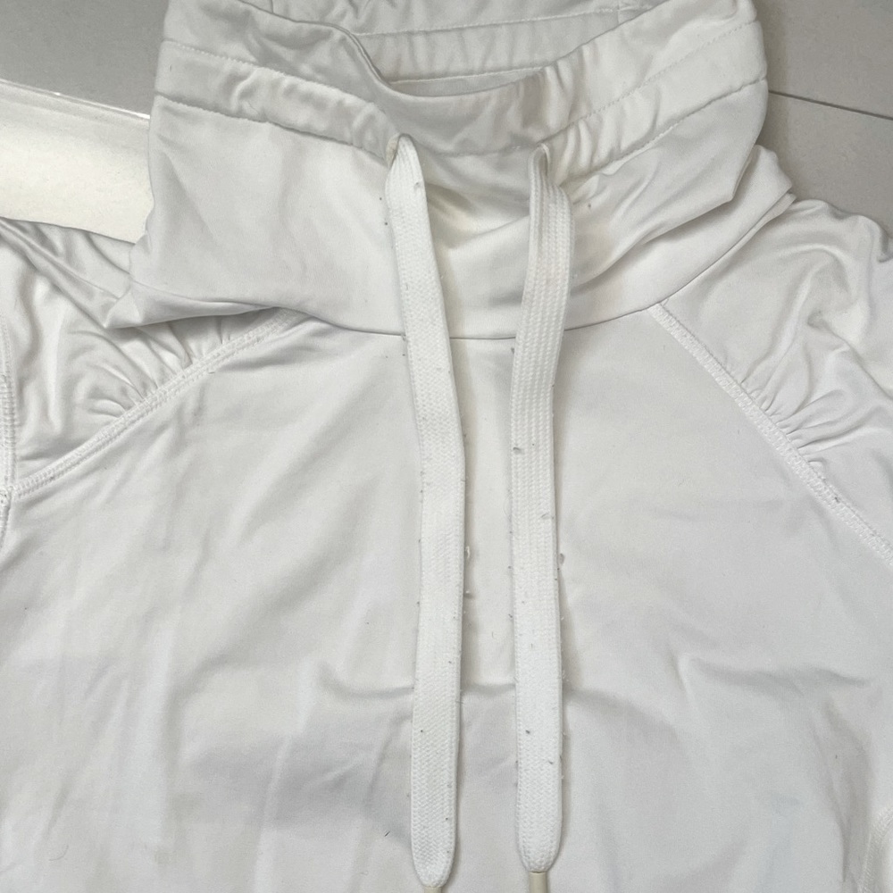 Layer 8 performance long sleeve pullover running top with fleece lining.